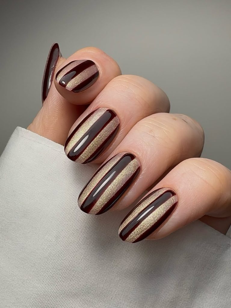 Gold-Striped Burgundy Nails
